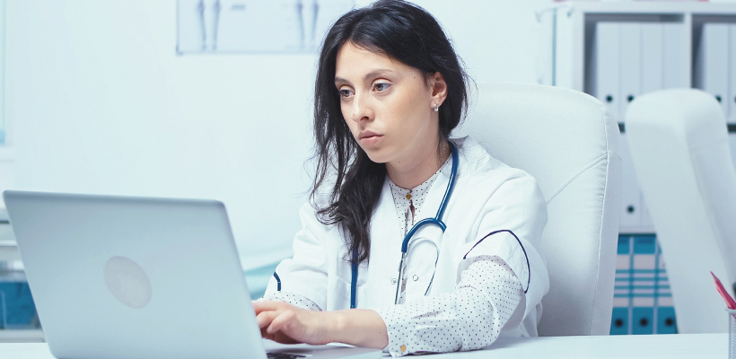 Female nurse with a laptop